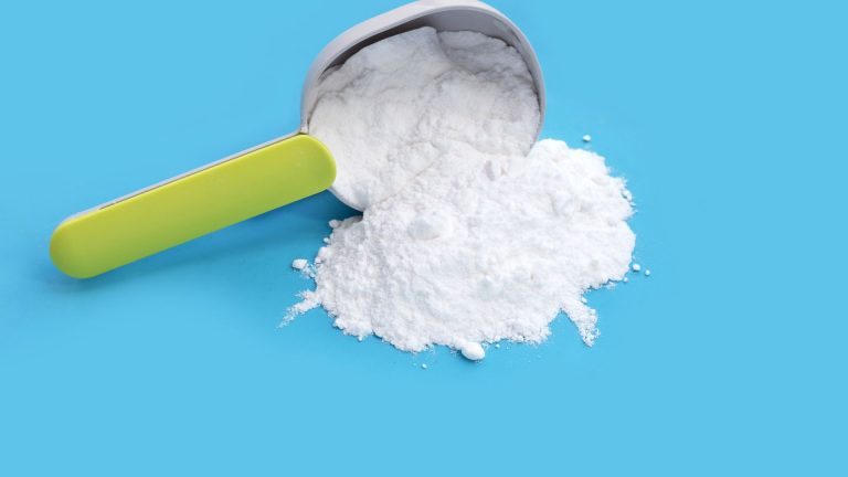 Baking soda on blue background.