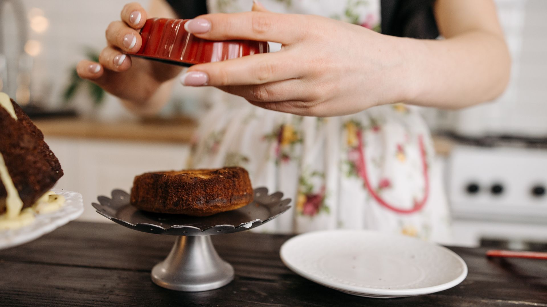 A Close-Up Shot of a Baker Demolding a Cake