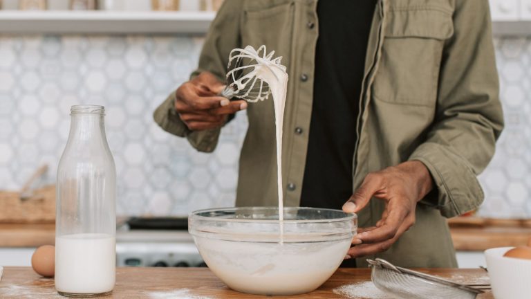 A Man Checking the Texture of the Batter