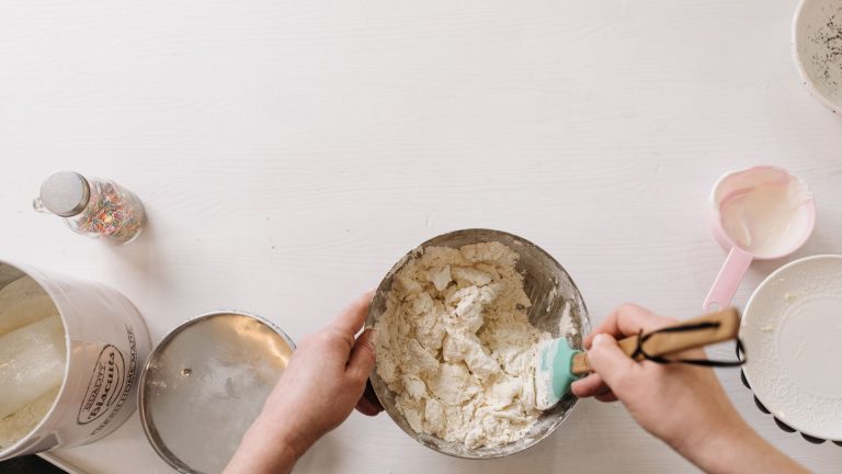 A Person Folding Dough