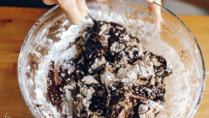 A Person Mixing a Dough