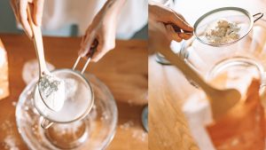 A Person Putting a Scoop of Flour on a Colander