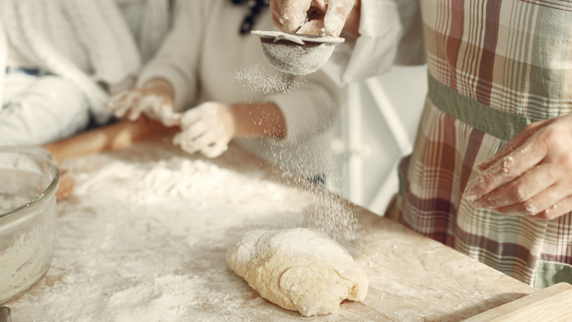 Crop woman mixing cake dough in kitchen