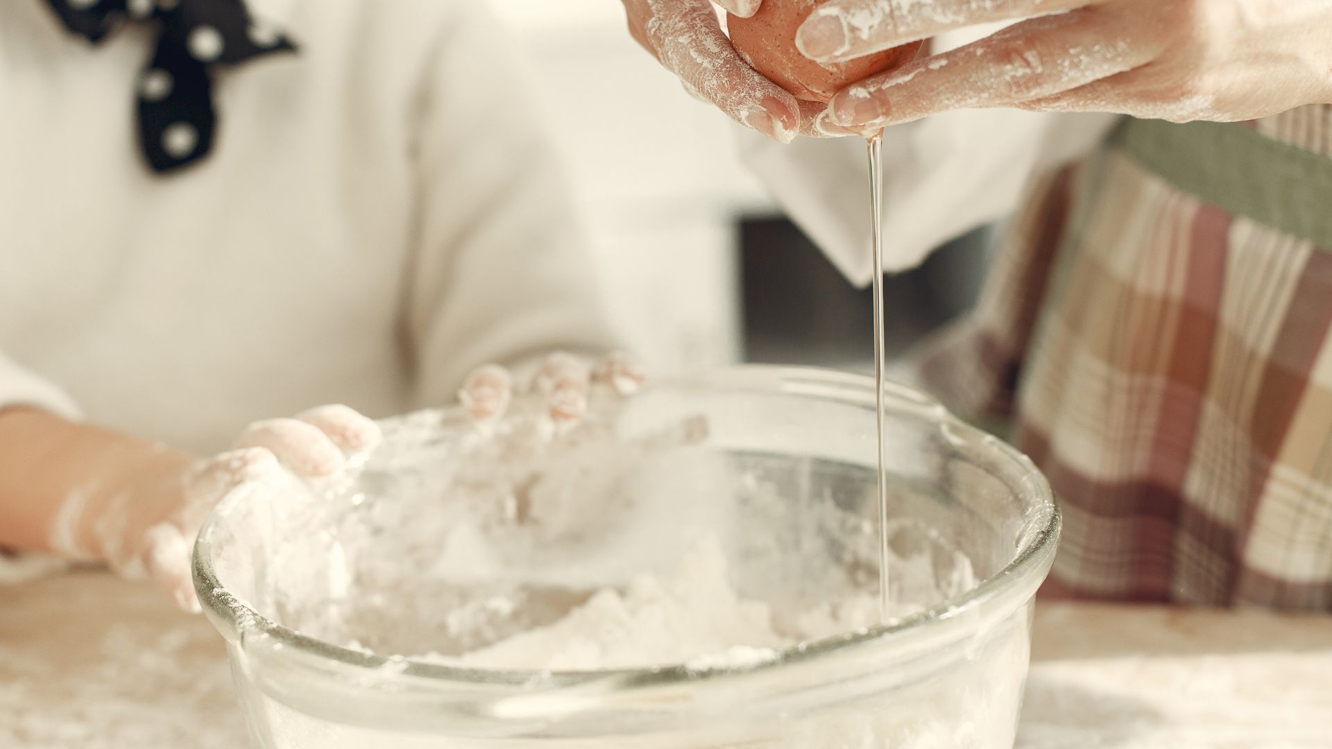 Daughter and Parent Making Cake Batter