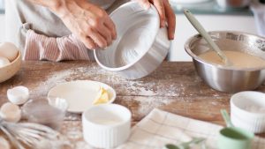 Person Greasing a Baking Pan