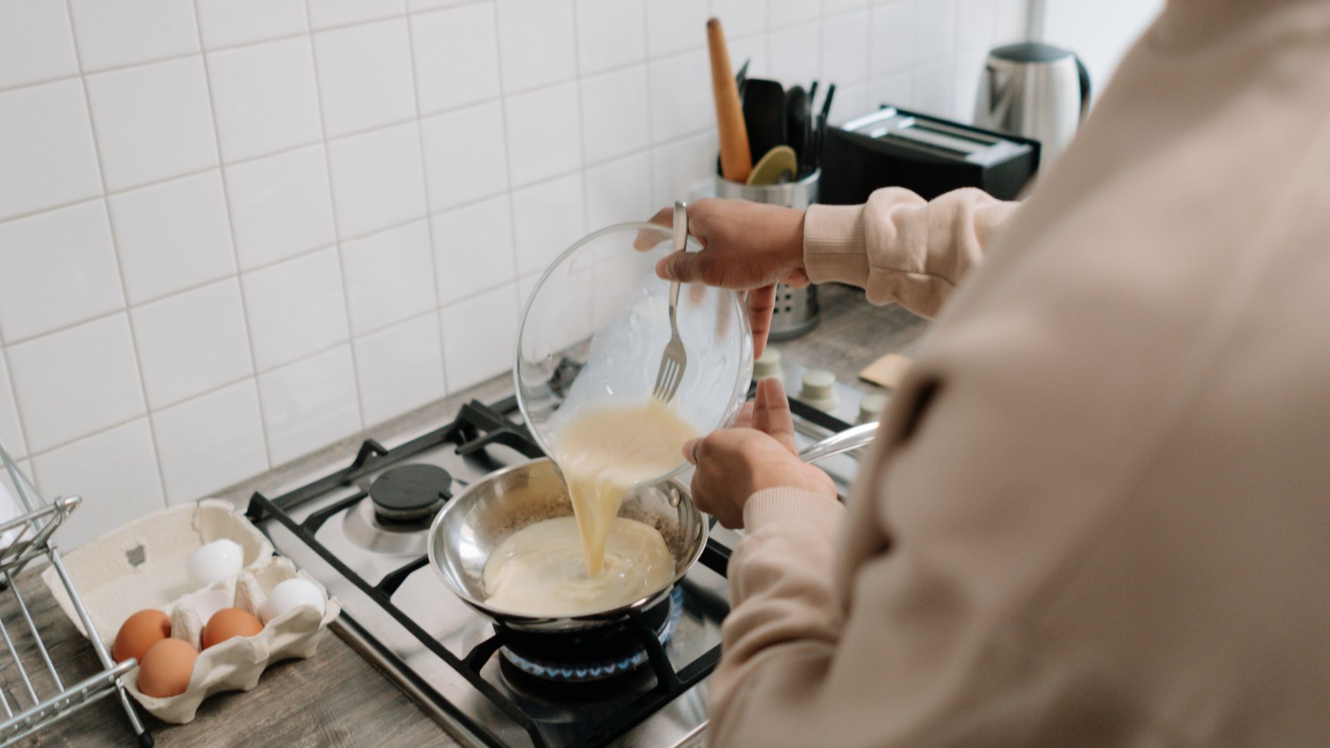 Person Holding Clear Glass Bowl Cooking