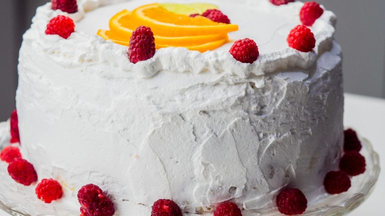 Photograph of a Cake with Red Raspberries