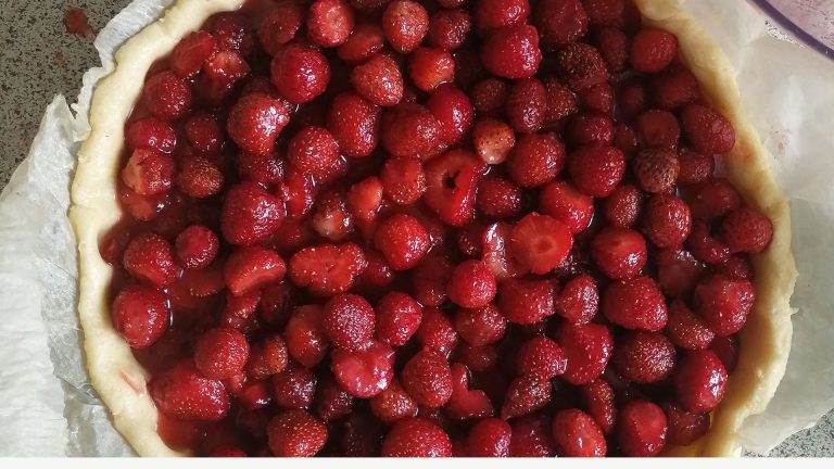 Red Round Fruit on White Ceramic Plate