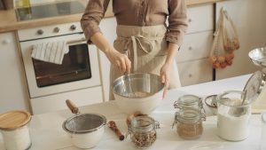 Woman Mixing Baking Ingredients in a Bowl