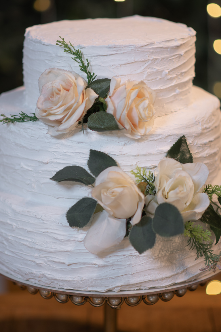 A Minimalist Wedding Cake on a Stand..